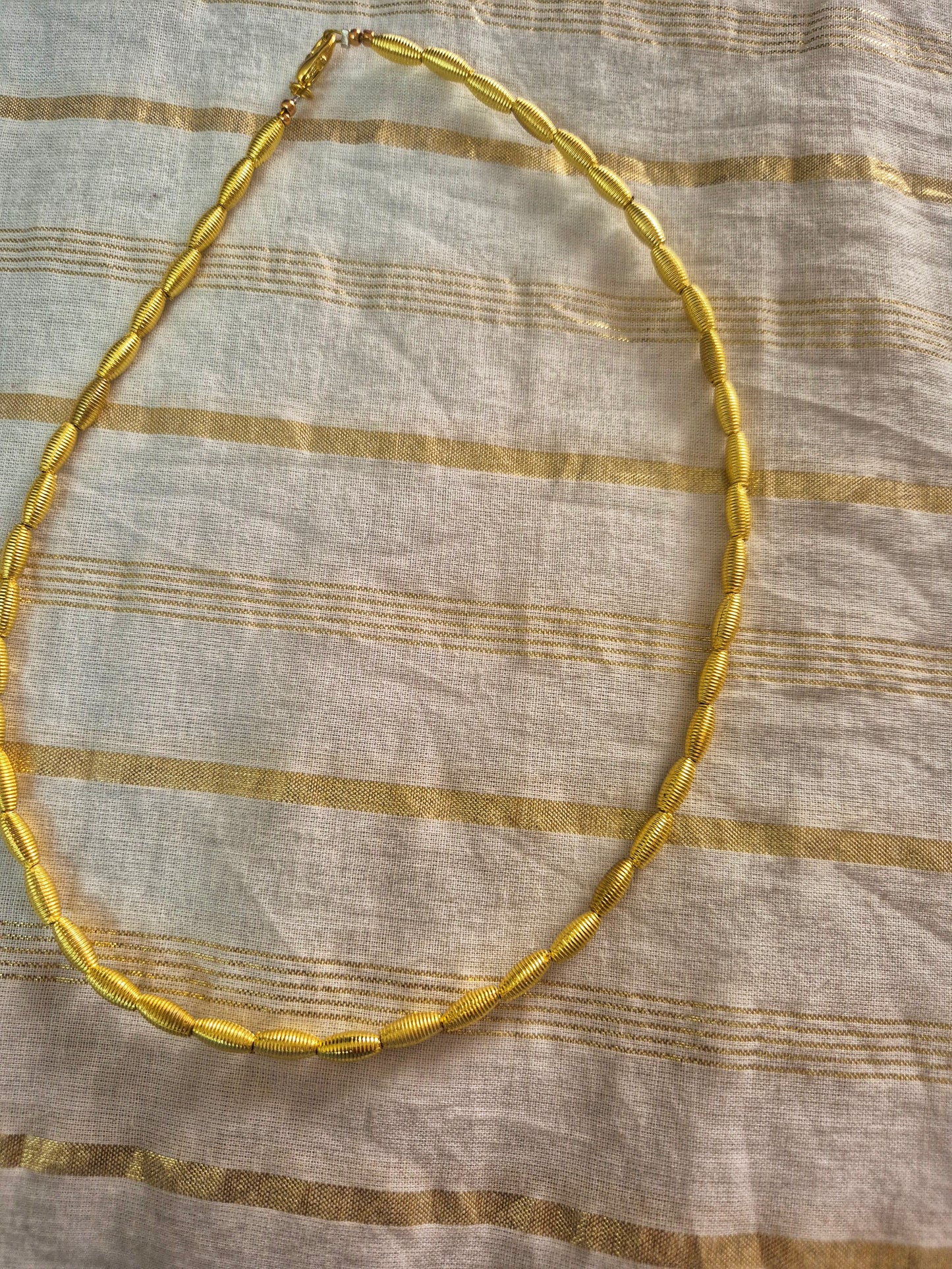 Golden bead choker