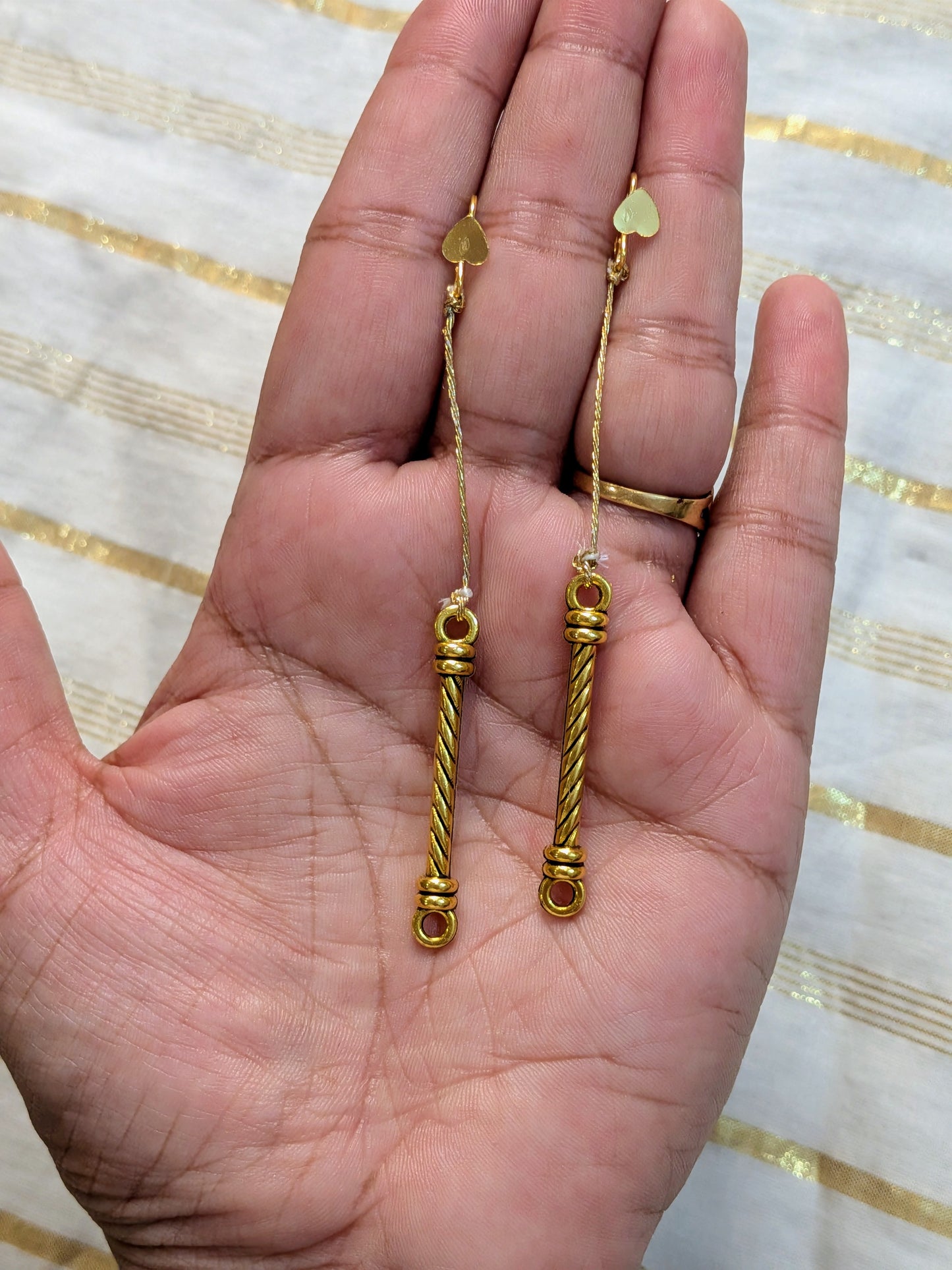 String golden earrings
