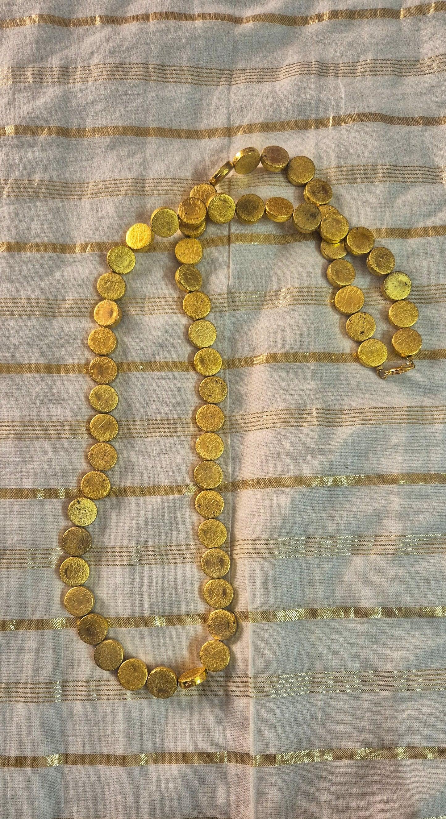 Blingy golden necklace round one